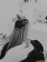 a woman getting her hair done in a salon