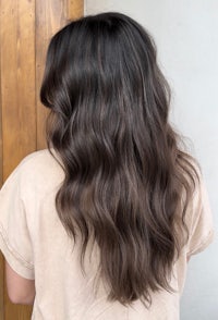 the back view of a woman with dark brown hair