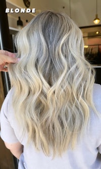 a woman with blonde hair in a salon