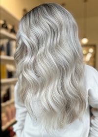 the back of a woman's hair in a salon